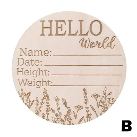 Wooden circular birth announcement sign with Hello World and floral designs, featuring natural wood chips