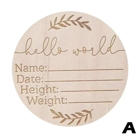 Wooden birth announcement disc with hello world text and blank spaces for natural wood chips