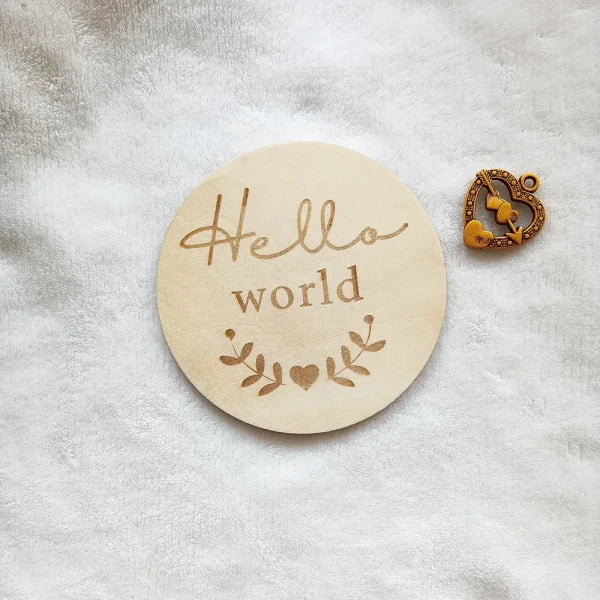 Circular wooden disc with Hello World and leaf designs for Natural Wood Chips