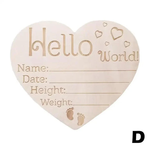Heart-shaped wooden birth announcement plaque featuring Hello World with natural wood chips detail