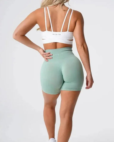 Mint green high-waisted Nvgtn Seamless Pro Spandex Shorts with a fitted silhouette