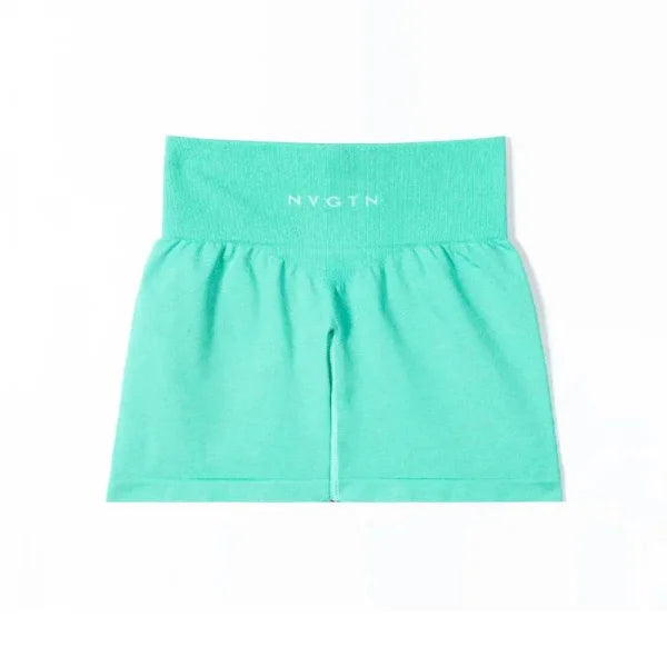Mint green Nvgtn Seamless Pro Spandex Shorts featuring a wide elastic waistband