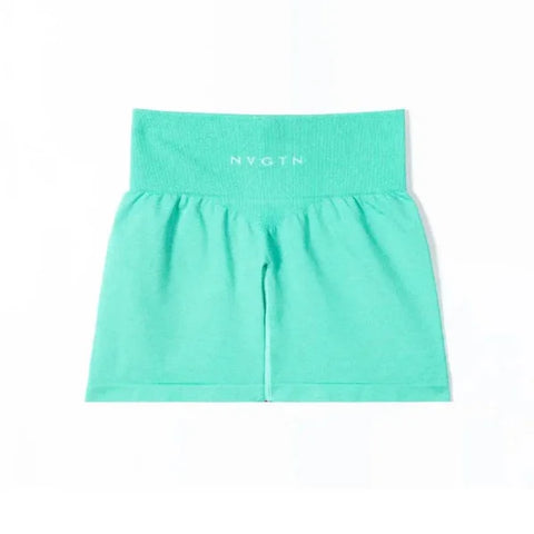 Mint green Nvgtn Seamless Pro Spandex Shorts featuring a wide elastic waistband