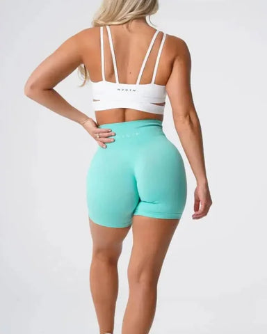Mint green Nvgtn Seamless Pro Spandex Shorts with a high-waisted fit for optimum comfort
