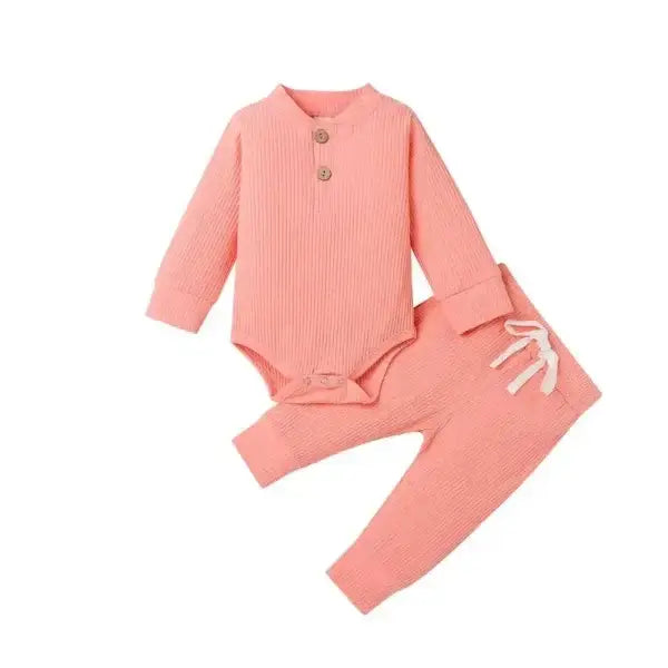 Nvgtn seamless pro spandex shorts in pink ribbed baby bodysuit and pants set