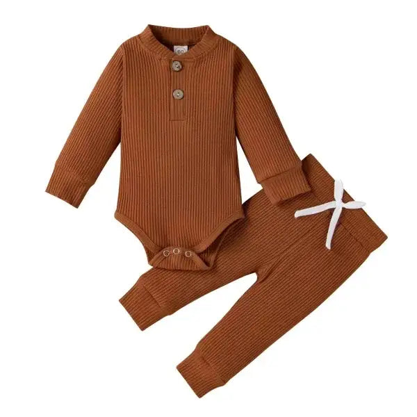 Nvgtn Seamless Pro spandex shorts in rust-colored ribbed knit baby outfit