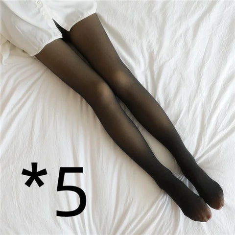 Black nylon fleece lined tights on legs against white fabric for fall and winter comfort
