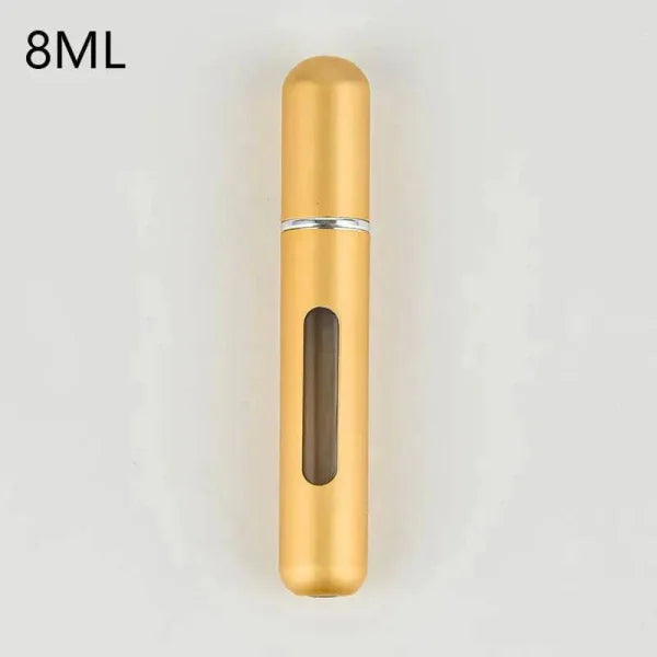 Gold portable perfume atomizer with viewing window for travel fragrance companion
