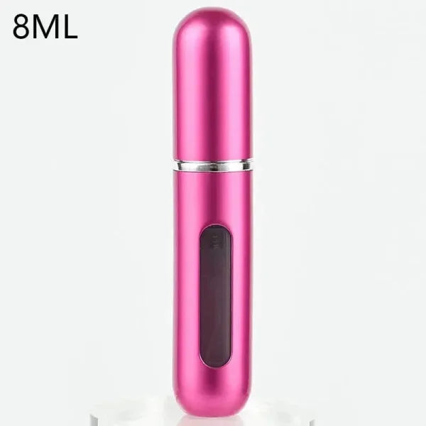 Pink metallic portable perfume atomizer with viewing window for travel fragrance companion