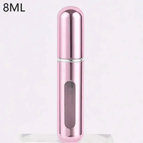 Pink metallic portable perfume atomizer with viewing window for travel fragrance companion