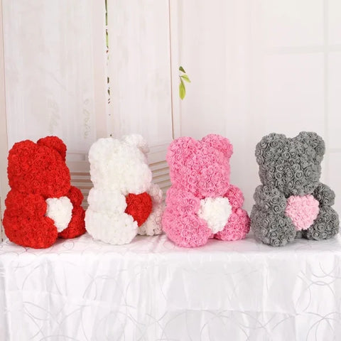 Four teddy bears made of roses in red, white, pink, and gray for foam wedding decorative pieces