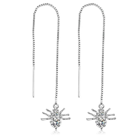 Silver Star Tassel Earrings showcasing starburst designs with crystal accents for elegance