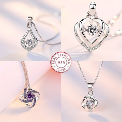 Sterling silver necklace pendants with crystal heart and swirl designs for elegant style