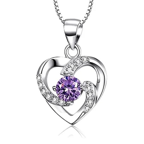 Sterling silver necklace pendant featuring a purple crystal and clear zircon stones