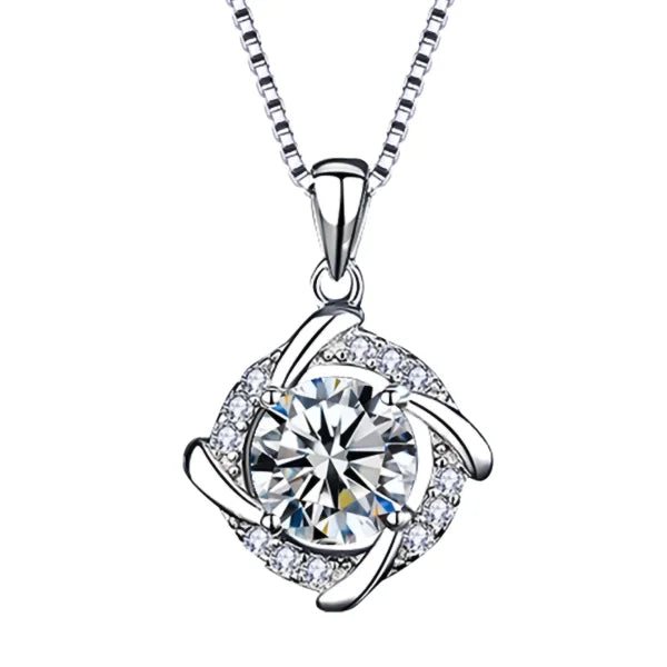 Sterling silver necklace pendant with round crystal, swirling metalwork, and diamonds