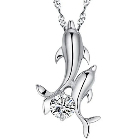 Sterling silver necklace featuring a silver dolphin pendant with crystal accent