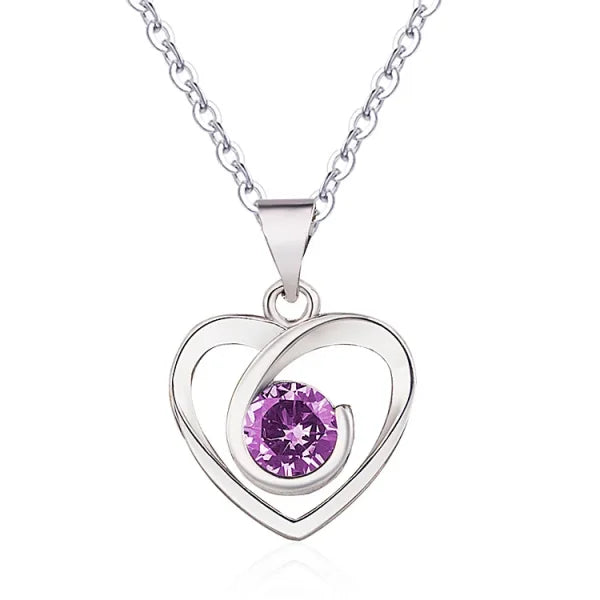 Sterling silver necklace with heart-shaped pendant featuring purple crystal accent