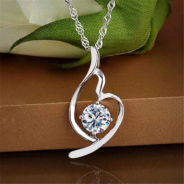 Sterling Silver Necklace featuring a heart-shaped pendant with a crystal centerpiece