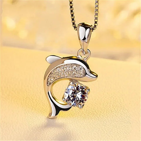 Sterling silver necklace featuring a dolphin pendant with crystal accents and rhinestones