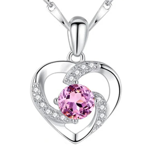 Sterling silver necklace pendant featuring a pink gemstone and diamond accents