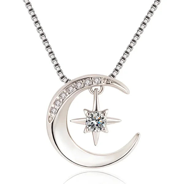 Sterling silver necklace featuring a crescent moon and star pendant with crystal accents