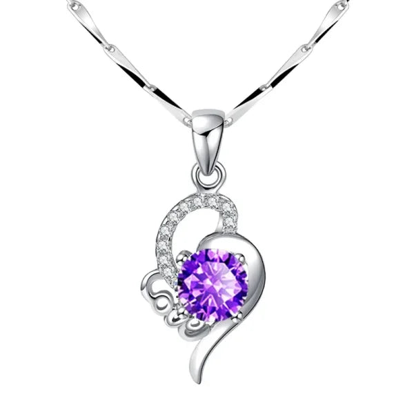 Sterling silver necklace with heart-shaped pendant, purple gemstone, and crystal accents