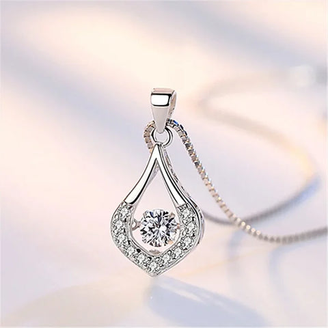 Elegant sterling silver necklace featuring a teardrop-shaped pendant with diamonds