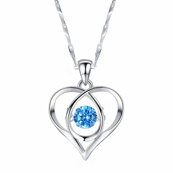 Sterling silver necklace pendant featuring a blue crystal in a heart design