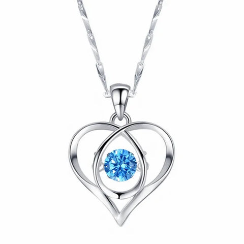 Sterling silver necklace pendant featuring a blue crystal in a heart design