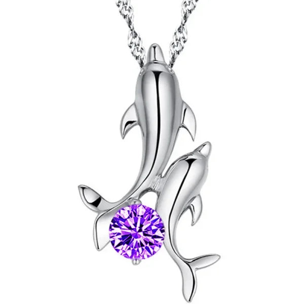 Sterling silver necklace featuring a silver dolphin pendant and purple crystal accent