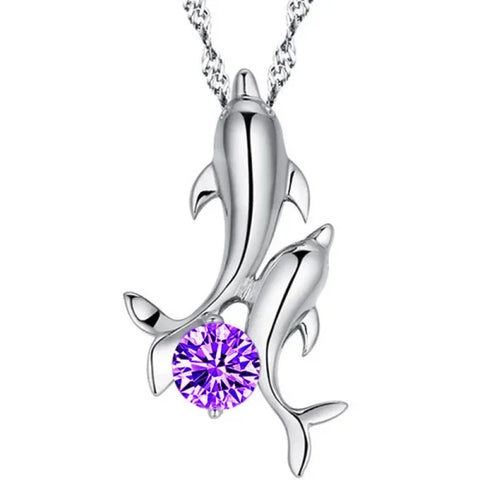 Sterling silver necklace featuring a silver dolphin pendant and purple crystal accent