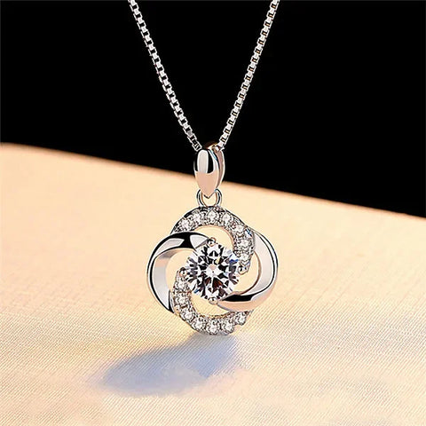 Sterling Silver Necklace Pendant featuring a diamond-encrusted flower-like design