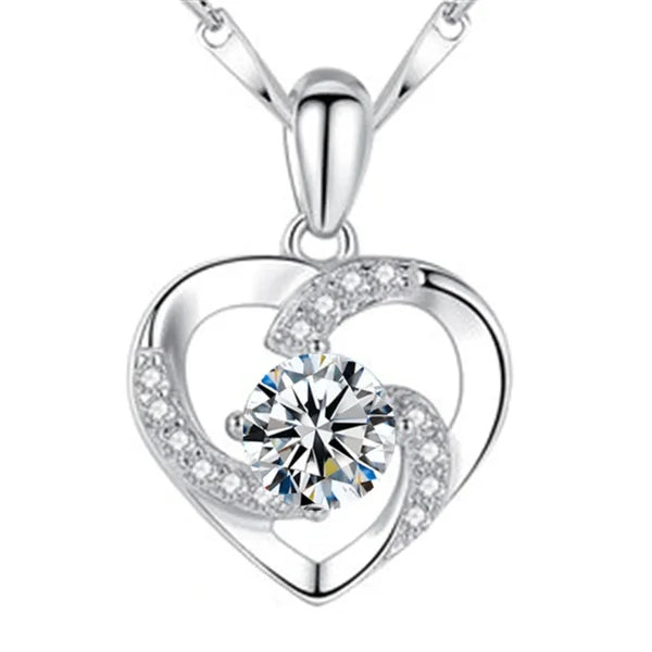 Sterling silver necklace pendant featuring a heart shape with crystal accents and zircon stone