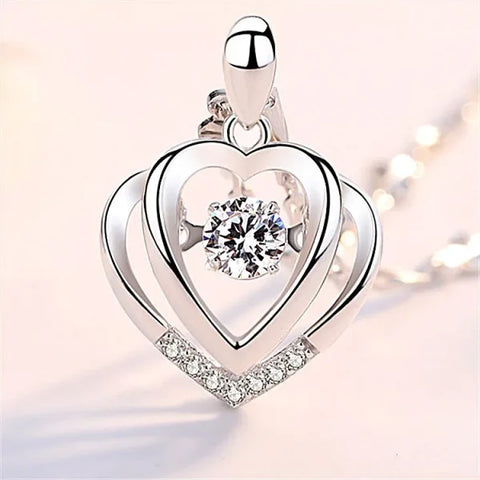 Sterling silver necklace pendant with dancing diamond heart and crystal accents