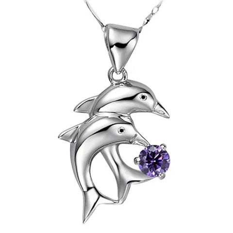 Sterling silver necklace pendant with two dolphins and a purple gemstone accent