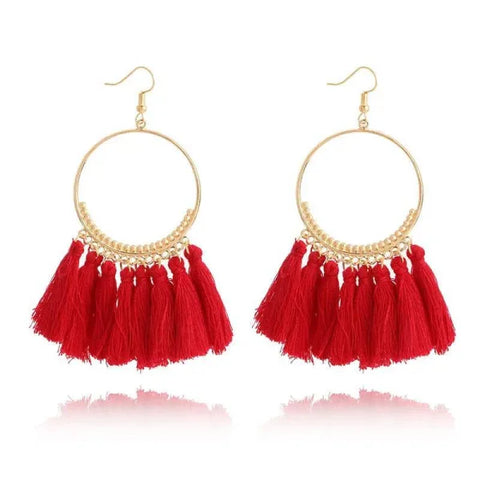 Gold hoop drop dangle earrings featuring red tassels for a bold fashion statement
