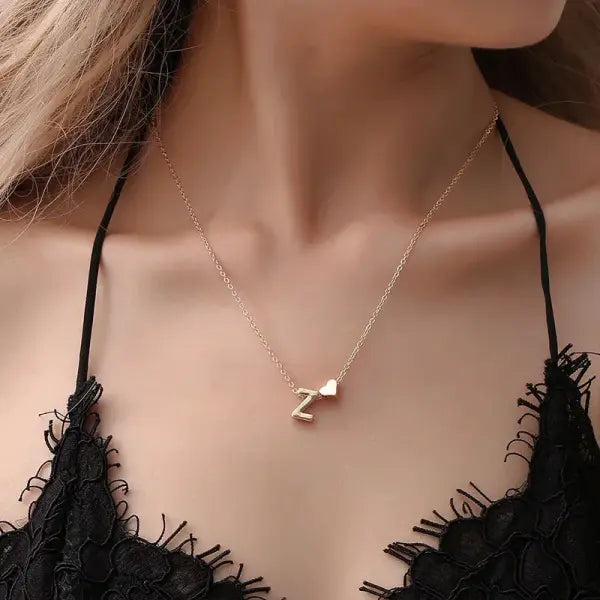 Initial necklace with dainty heart pendant