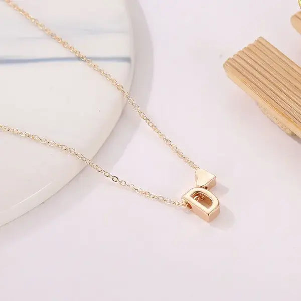 Initial necklace with dainty heart pendant