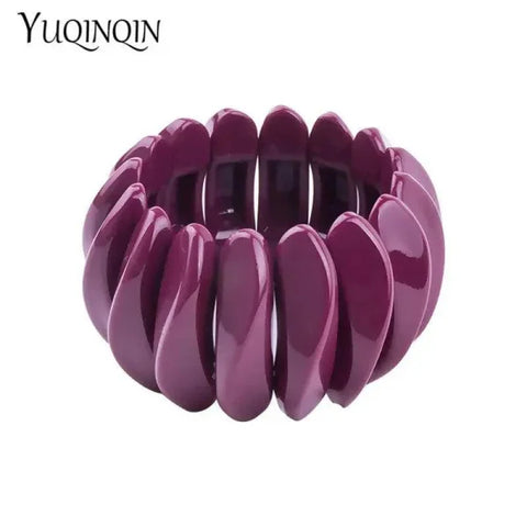 Purple elastic vintage cuff bracelet made of curved plastic segments for women’s fashion