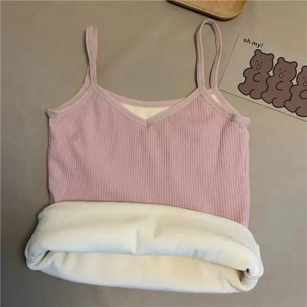 Pink ribbed thermal undershirt with white lining in a warm sleeveless crop design