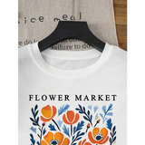 Yellow flowers market cotton t-shirt with a loose fit